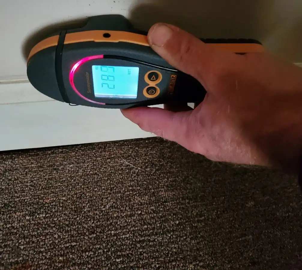 Moisture detection at baseboard during Burst Pipe Cleanup in Medina
